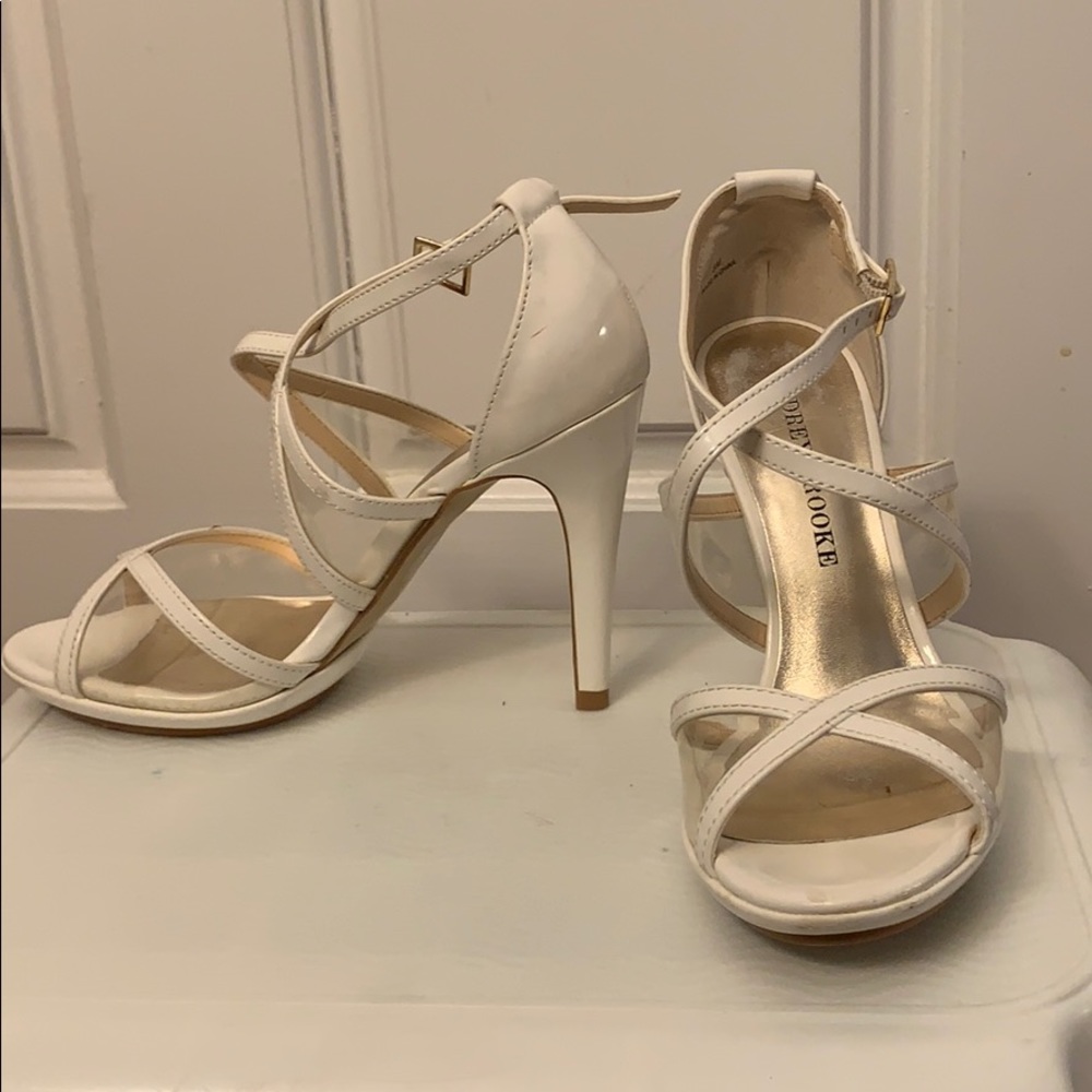 White heels with clear plastic.